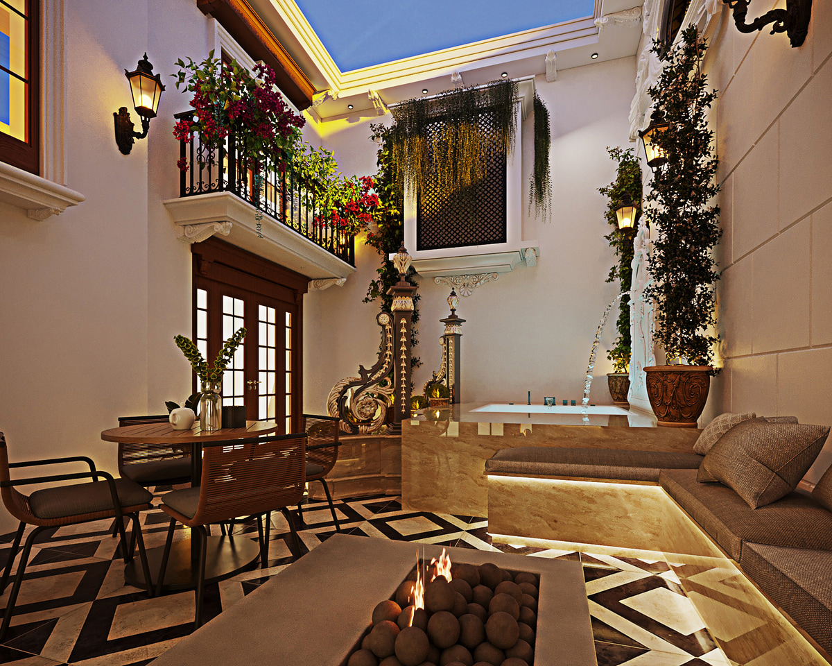 Courtyard with a dining table, planted walls and classical stone details