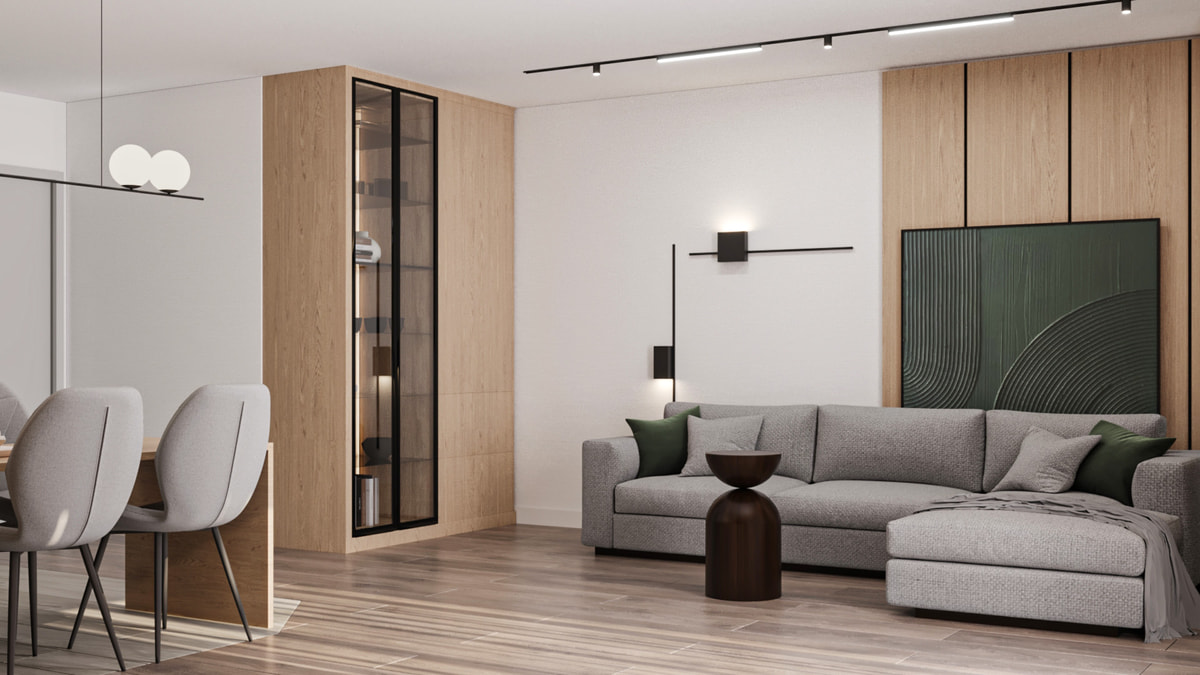 Compact living area with green accents and light timber cabinetry