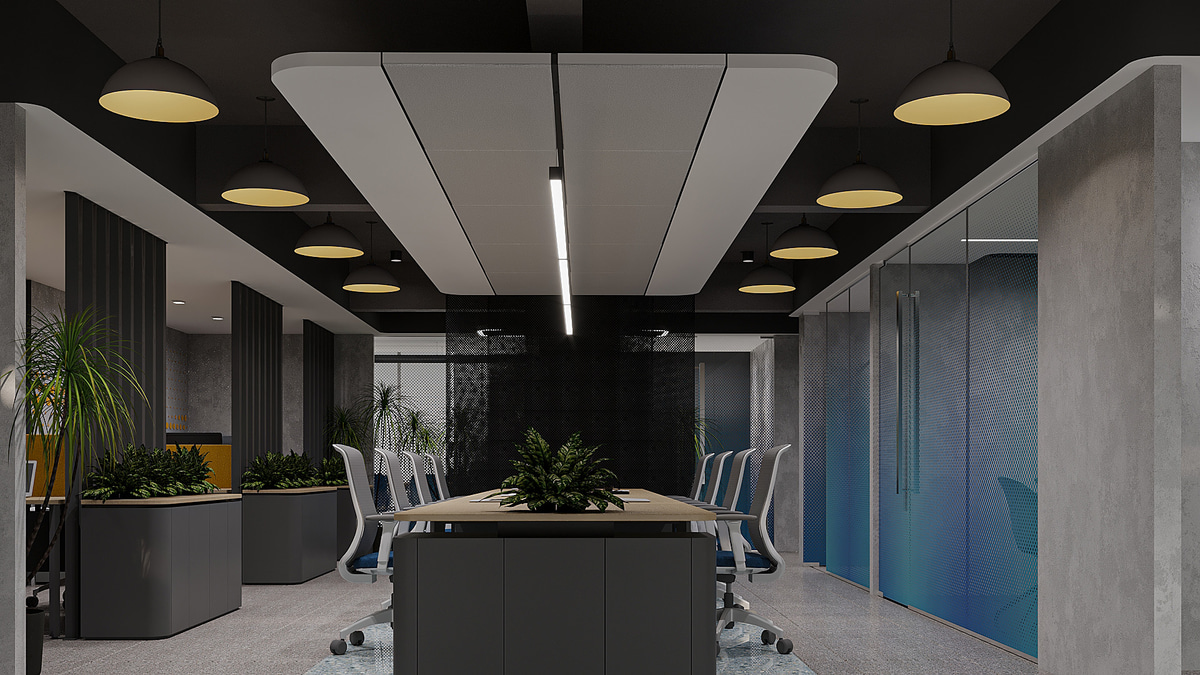 Open office with workstations and geometric ceiling lighting