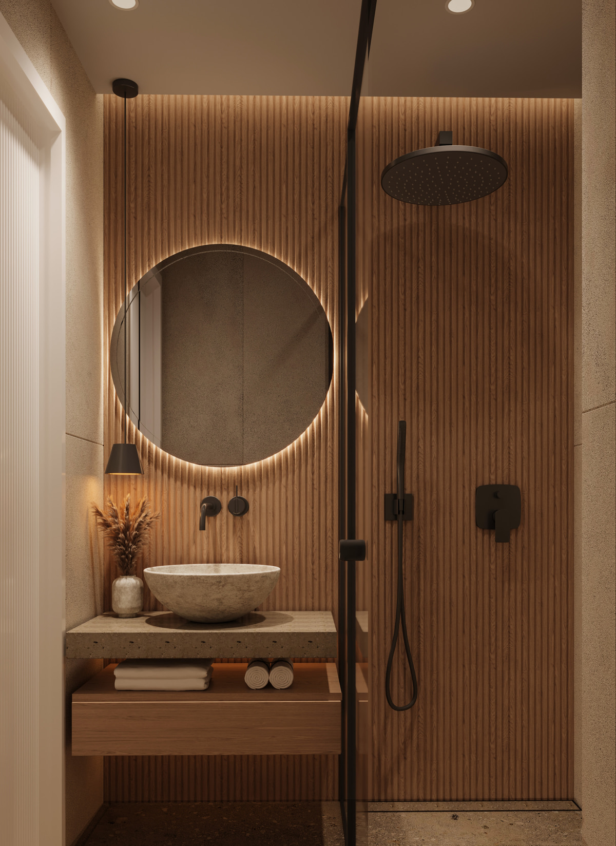 Bathroom with warm stone, a circular mirror and a walk-in shower